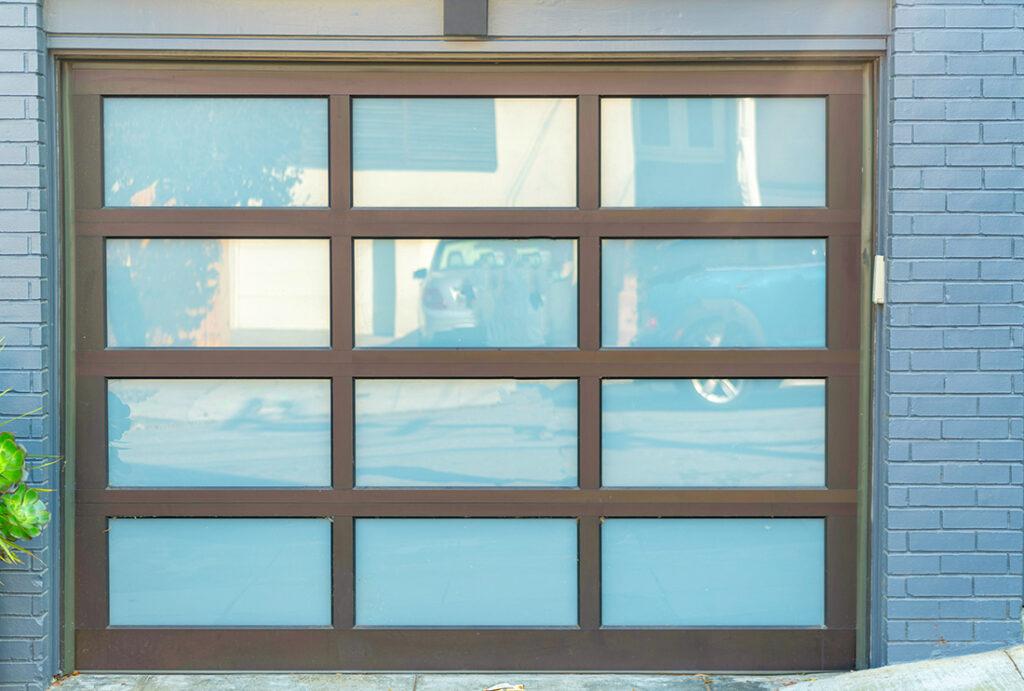 2024-09-–-TNT-Garage-Doors-BLOGM4.11-The-Pros-and-Cons-of-Glass-Panel-Garage-Doors
